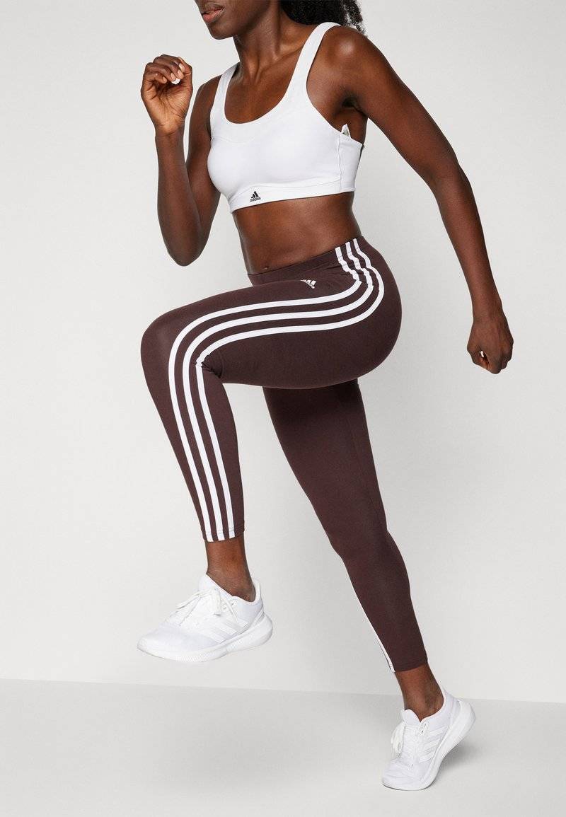 adidas Sportswear adidas Sportswear ESSENTIALS 3 STRIPES HIGH WAISTED - Leggings - shadow brown Vatertagsangebot