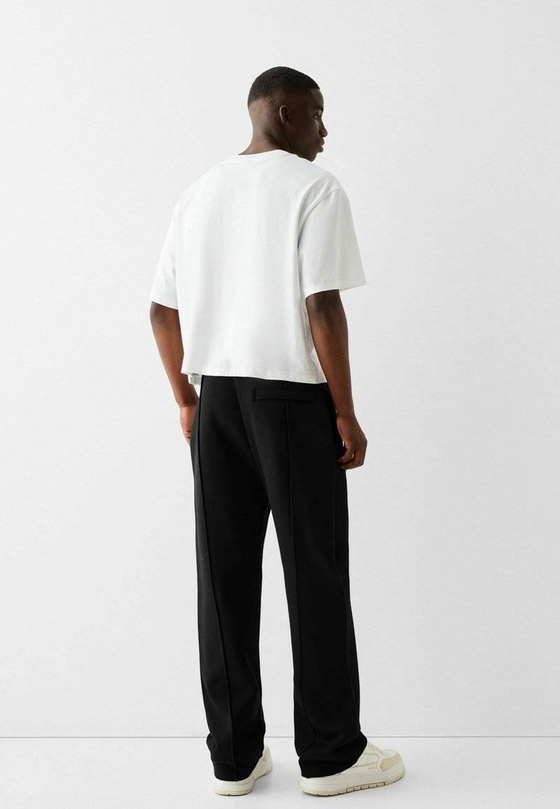 Bershka Bershka WIDE - Tracksuit bottoms - black Begrenzt auf 3 Tage