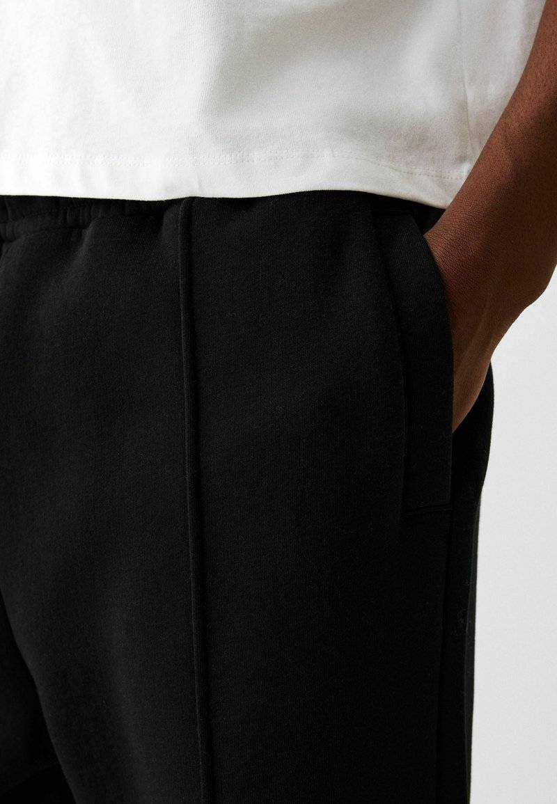 Bershka Bershka WIDE - Tracksuit bottoms - black Begrenzt auf 3 Tage
