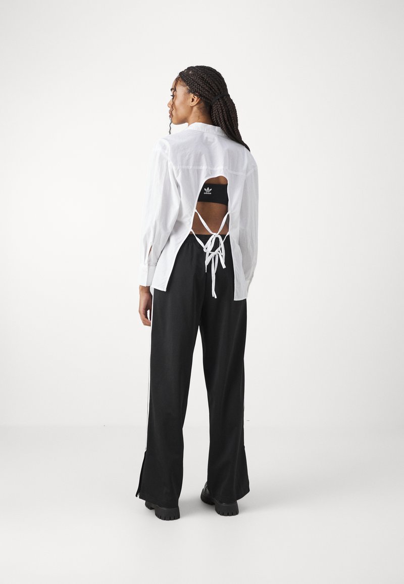 adidas Originals adidas Originals FBIRD LOOSE - Tracksuit bottoms - black Zeitbegrenzte Promotion