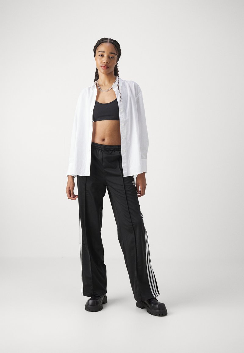 adidas Originals adidas Originals FBIRD LOOSE - Tracksuit bottoms - black Zeitbegrenzte Promotion