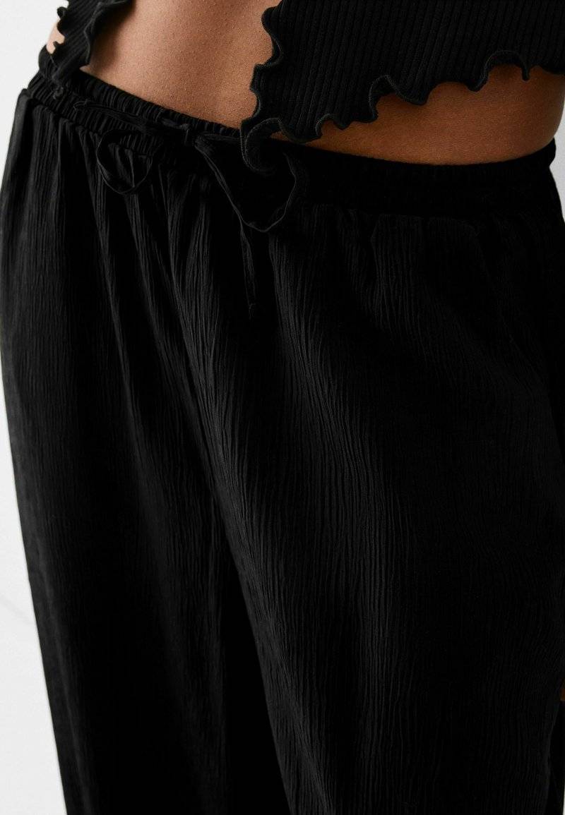 Bershka Bershka Trousers - black Bis zu 60% Rabatt