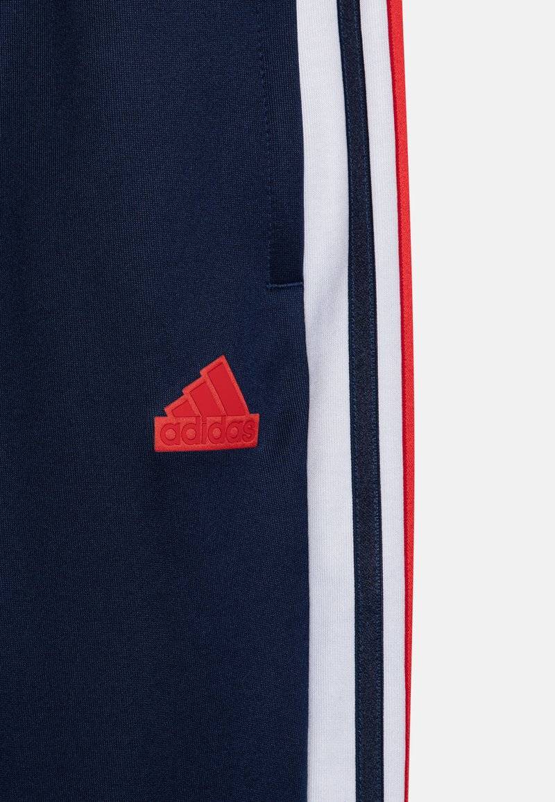 adidas Performance adidas Performance TIRO NATIONS PACK UNISEX - Tracksuit bottoms zollfrei