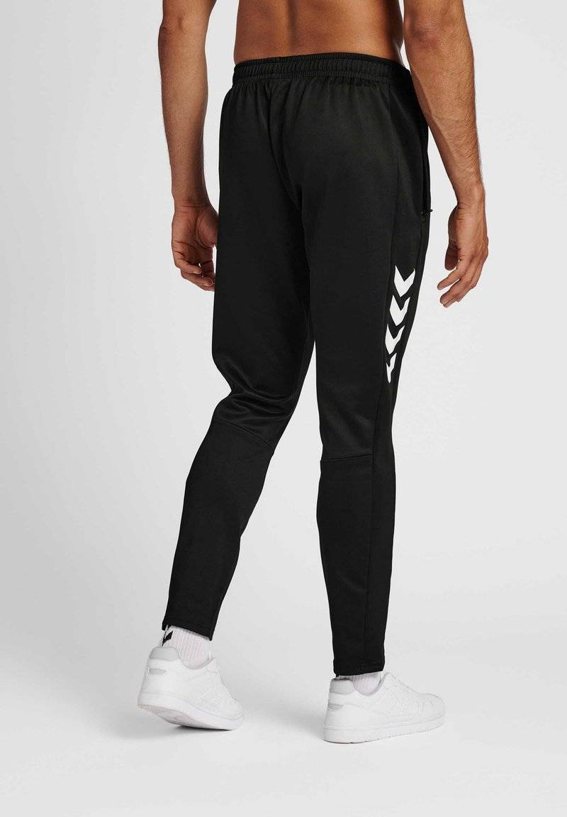 Hummel Hummel CORE XR TRAINING PANTS - Tracksuit bottoms - black Outlet