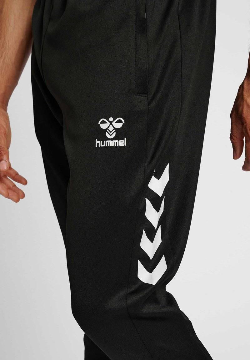Hummel Hummel CORE XR TRAINING PANTS - Tracksuit bottoms - black Outlet