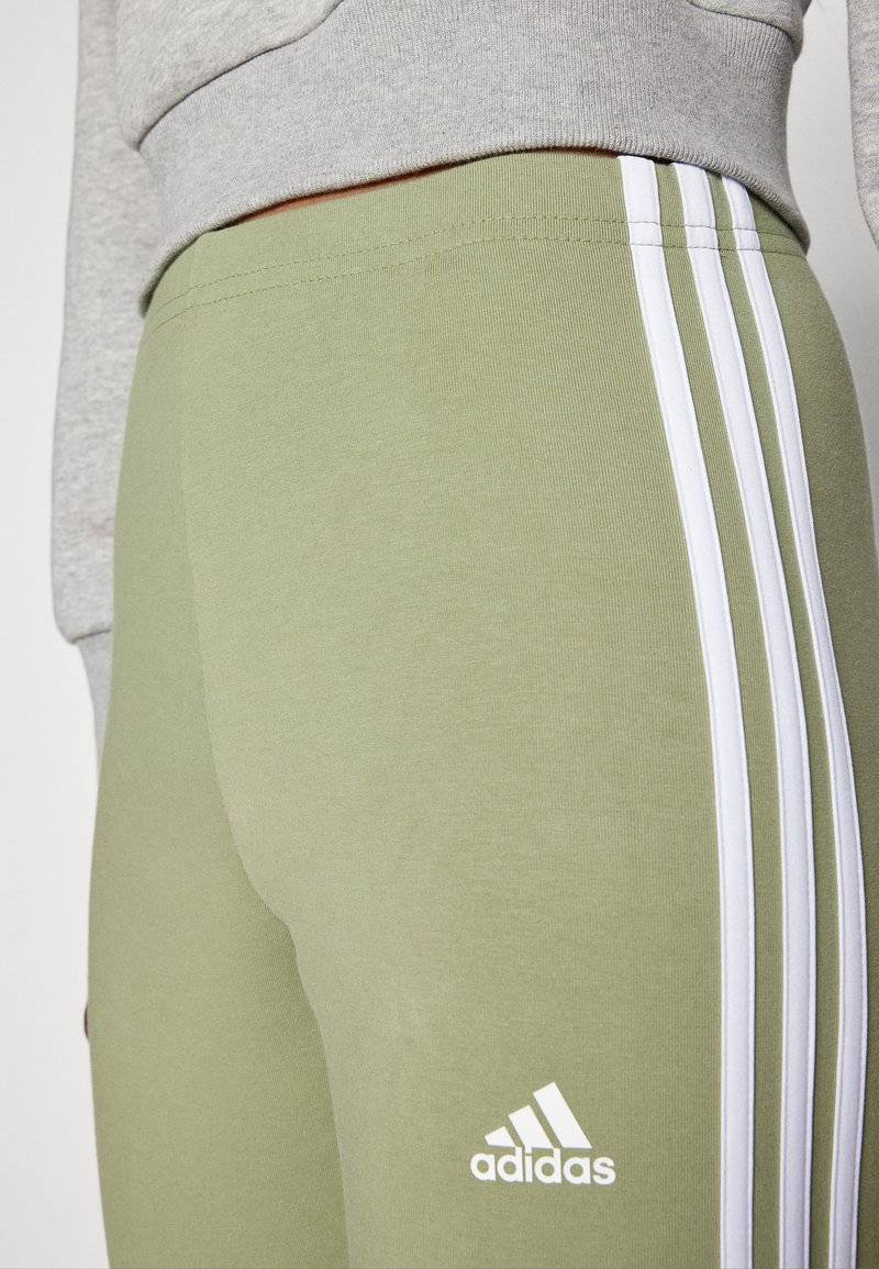 adidas Sportswear adidas Sportswear ESSENTIALS 3 STRIPES HIGH WAISTED - Leggings - tent green Hotsell