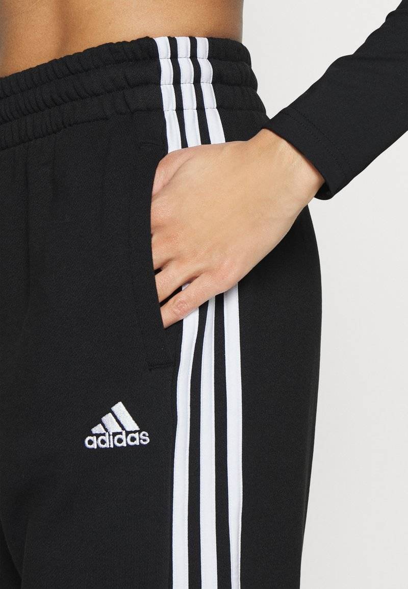 adidas Sportswear adidas Sportswear ESSENTIALS 3-STRIPES LOOSE-FIT - Tracksuit bottoms Limitierter Zeitrabatt